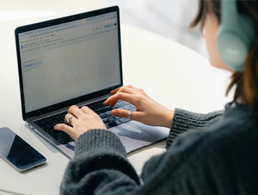 A lady working on a laptop