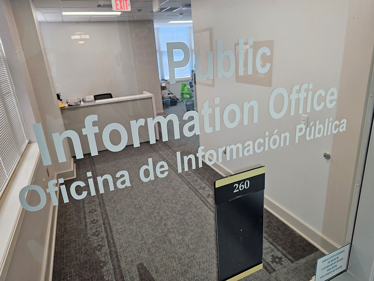 Front window of the Durham County Public Information Office from the outside.