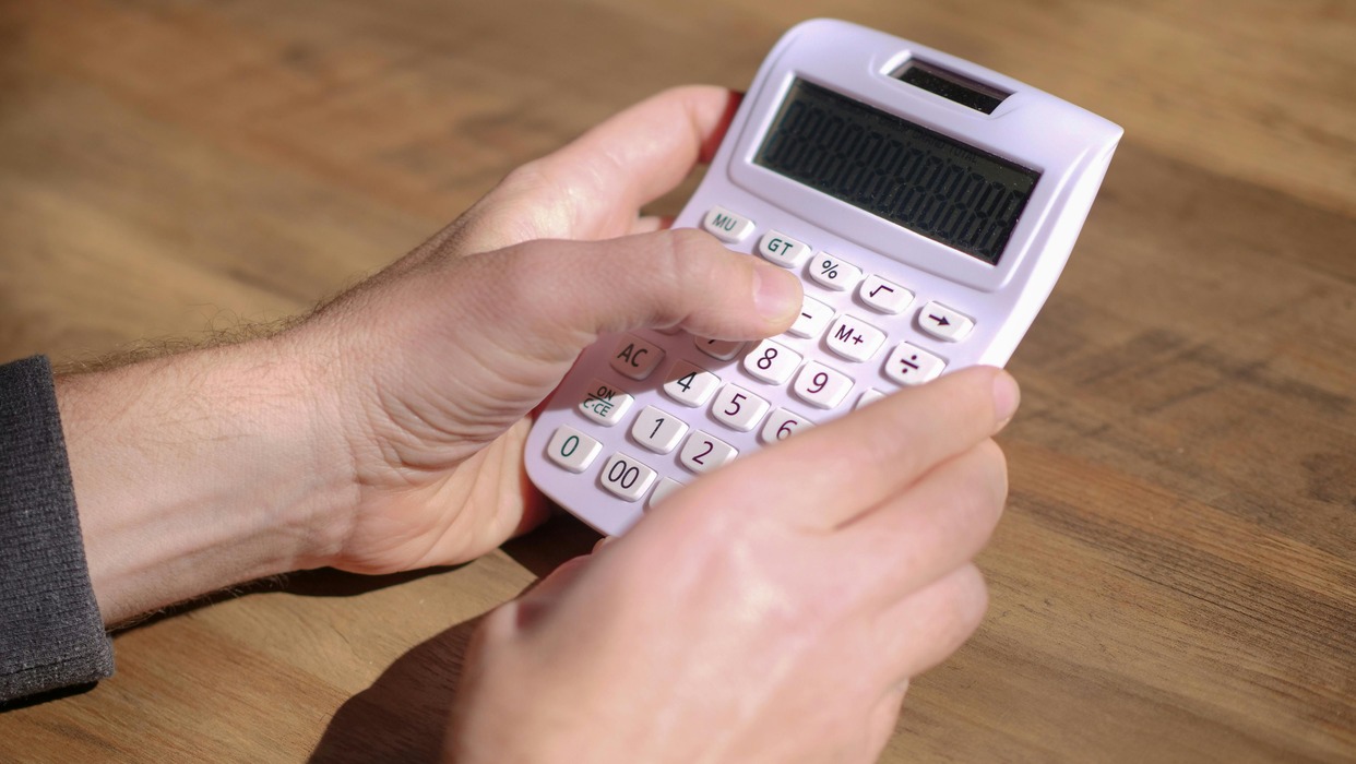 Person holding calculator
